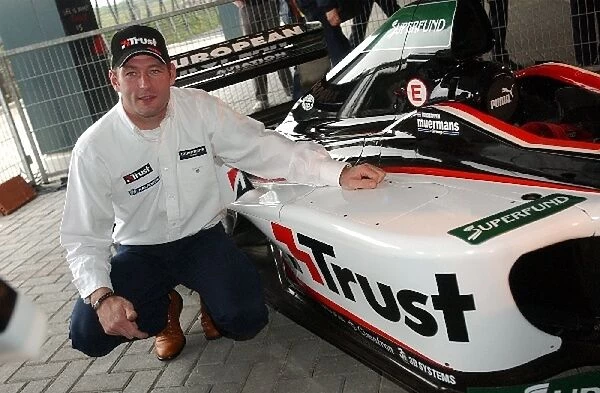 Jos Verstappen (NED) Minardi next to the Minardi Cosworth PS01 with Trust title sponsorship