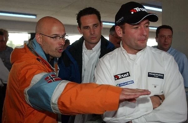 Jos Verstappen (NED) Minardi, right, talking with Rob Kamphuis (NED) Dutch TV presenter