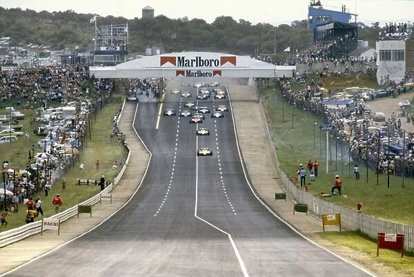 Kyalami, South Africa. 23 January 1982: Rene Arnoux, Renault RE30B, 3rd position, and Alain Prost, Renault RE30B, 1st position, lead at the start