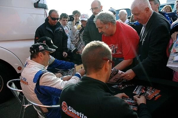 Le Mans Series: L-R: Lawrence Tomlinson  /  Nigel Mansell  /  Greg Mansell, Team LNT, sign autographs for the fans