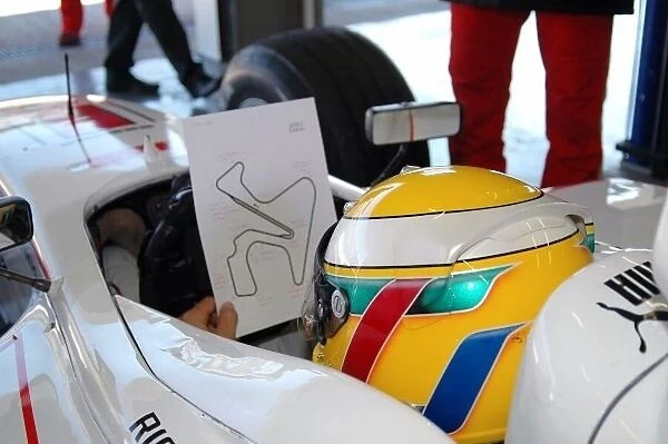 GP2. Lewis Hamilton (GBR) ART studies the track map.