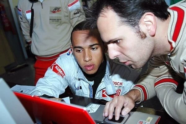 GP2. Lewis Hamilton (GBR) ART talks with the engineers.