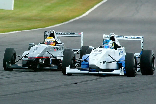 Lewis Hamilton passes Alexander Storckenfeldt for the lead. Formula Renault Championship