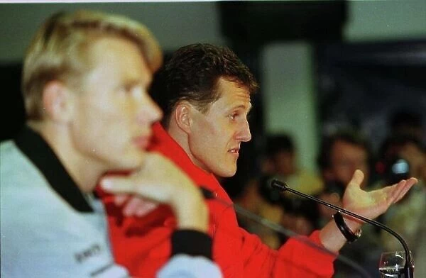 LUXEMBOURG GP - NUBURGRING 24 SEPT 1998 MICHEAL SCHUMACHER AND MIKA HAKKINEN HEAD TO HEAD DURING THE PRE WEEKEND PRESS CONFERENCE PHOTO: STEVE ETHERINGTON