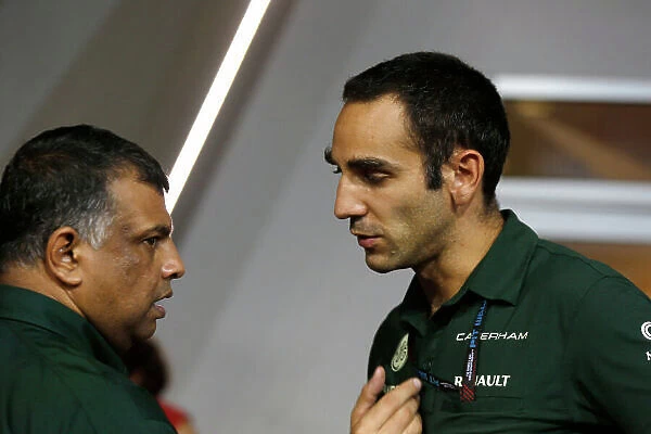 Marina Bay Circuit, Singapore. Friday 20th September 2013. Tony Fernandes, Co-Chairman, Caterham Group with Cyril Abiteboul, Team Principal, Caterham F1. World Copyright: Charles Coates / LAT Photographic. ref: Digital Image _N7T2907