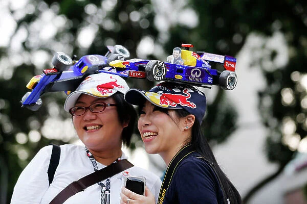 Marina Bay Circuit, Singapore. Friday 20th September 2013. Red Bull Racing fans with car hats. World Copyright: Steven Tee / LAT Photographic. ref: Digital Image _L0U1001