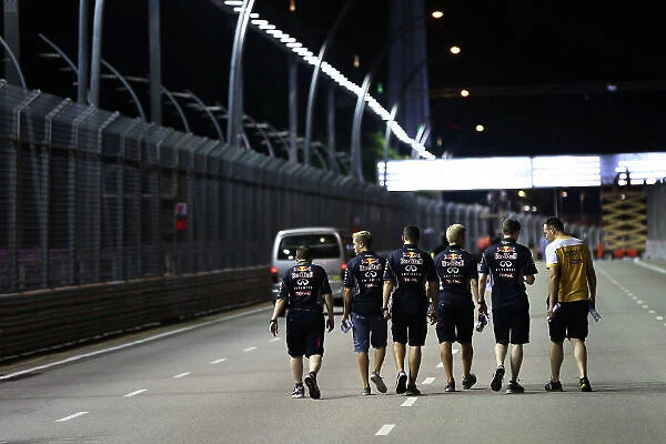 Marina Bay Circuit, Singapore. Thursday 19th September 2013. Sebastian Vettel, Red Bull Racing walks the track with his team. World Copyright: Andy Hone / LAT Photographic. ref: Digital Image HONZ0657