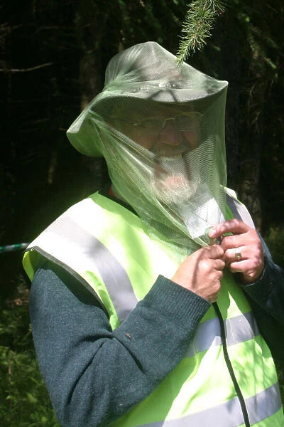A marshal hiding from the locals! The midges that is! 2004 Pirelli British Rally