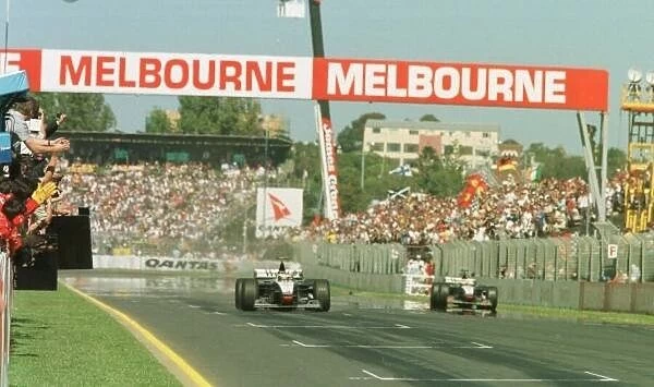 SE 6. Mika Hakkinen and David Couthard crossing the finish line of the