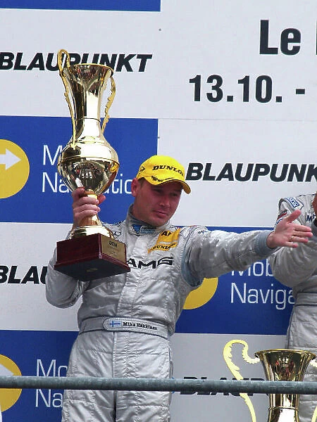DTM. Mika Hakkinen (FIN) AMG-Mercedes C-Klasse 06 on the podium