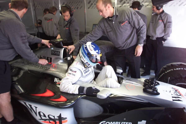 Mika Hakkinen gets in his car