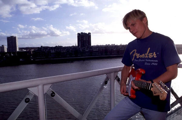 MIKA SALO AT HOME IN LONDONs DOCKLANDS SEEN HERE WITH HIS GUITAR PHOTO: LAT