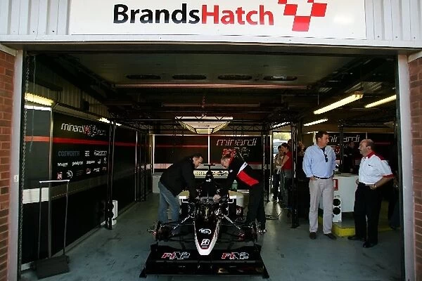 Minardi F1X2: Thre Minardi F1X2 pit garage
