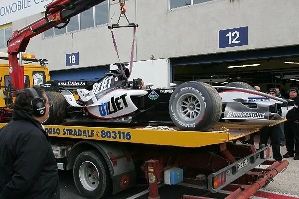 Minardi Testing: Chanoch Nissany Minardi is lifted into the pitl ane after his spin