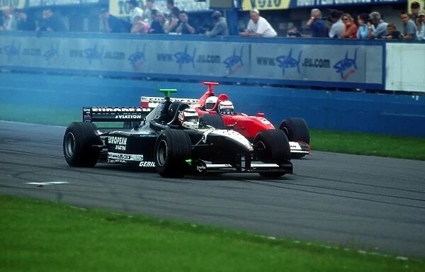 Minardi Thunder In The Park Day: l-r. Nigel Mansell gets the better start ahead of Minardi team owner Paul Stoddart in the sports first two-seater