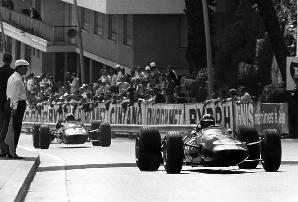 Monte Carlo, Monaco. 7 May 1967: Graham Hill, Lotus 33-BRM, 2nd position, leads Chris Amon, Ferrari 312, 3rd position, action