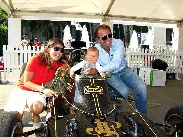 Montjuich Park: Emerson Fittipalidi, right, wife Teresa Fittipaldi, and son Luca Fittipaldi with the Lotus 72E