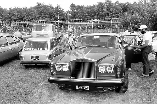 Monza, Italy. 10 September 1978: Mario Andretti gives Colin Chapman and Ronnie Peterson a lift in his Rolls-Royce
