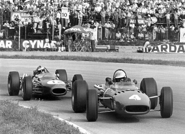Monza, Italy. 4 September 1966: Michael Parkes, Ferrari 312, 2nd position, leads Denny Hulme, Brabham BT20-Repco, 3rd position, action