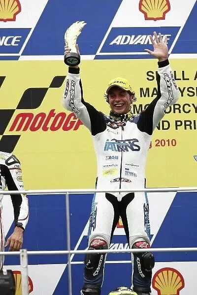 MotoGP. Moto2 race winner Roberto Rolfo (ITA), Suter celebrates on the podium.