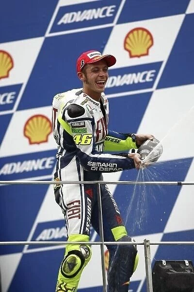 MotoGP. Race winner Valentino Rossi (ITA) sprays the champagne on the podium.