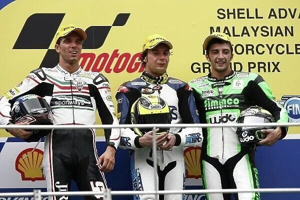 MotoGP. Moto2 podium (L to R):: Second placed Alex de Angelis 