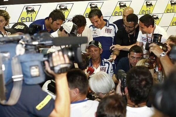 MotoGP. The media surround Valentino Rossi (ITA)
