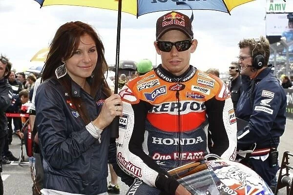 MotoGP. Race winner Casey Stoner (AUS), Repsol Honda on the grid with his wife Adriana.