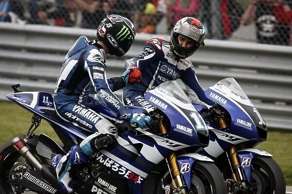 MotoGP. L-R: Ben Spies (USA) congratulates Yamaha Factory Racing team mate Jorge Lorenzo 