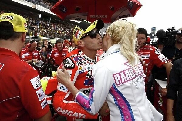 MotoGP. Valentino Rossi (ITA), Ducati Team, receives a kiss from Paris Hilton (USA).