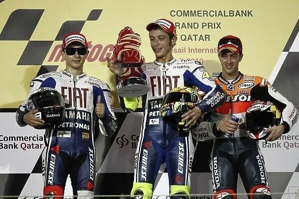 MotoGP podium and results:. 1st Valentino Rossi (ITA), FIAT Yamaha Team, centre.