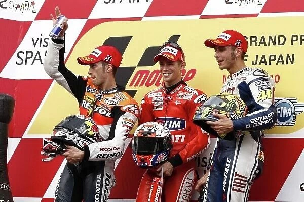 MotoGP podium and results:. 1st Casey Stoner (AUS), Marlboro Ducati, centre.