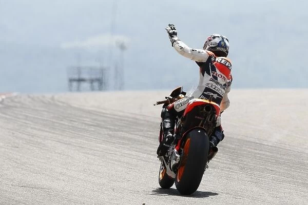 MotoGP: Race winner Dani Pedrosa, Repsol Honda Team, waves to the crowd