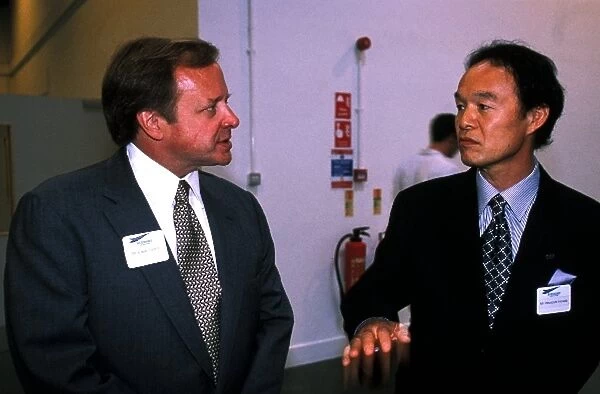 New Stewart Grand Prix Factory Tour: L-R; Edsel Ford II, great grandson of Henry Ford, in discussion with Hirotoshi Honda