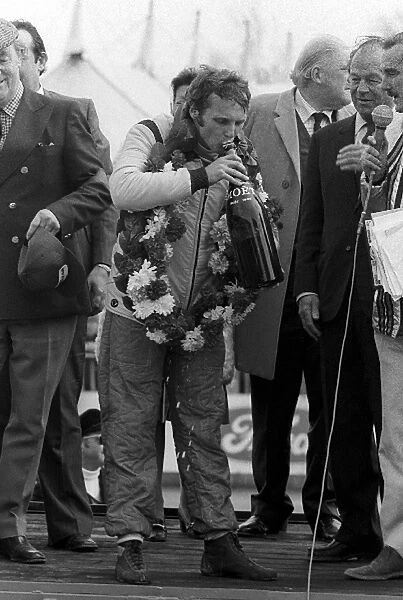 Non Championship Formula One: Race winner Niki Lauda Ferrari, celebrates his win on the podium