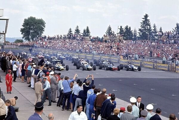 Nurburgring, Germany. 4-6 August 1967: Jim Clark, Denny Hulme, Jackie Stewart and Dan Gurney on the front row of the grid at the start