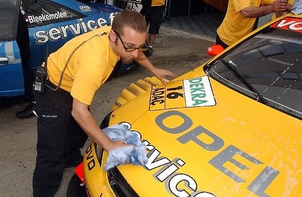 Opel mechanics wash the Opel Astra V8 Coupe in the pitlane: DTM Championship, Rd 2, Adria International Raceway, Italy, 11 May 2003