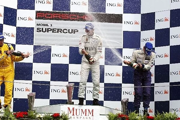 Porsche Supercup: Podium: Jan Seyffarth Seyffath Motorsport, Race winner Rene Rast and Jeroen Bleekemolen spray the champagne on the podium