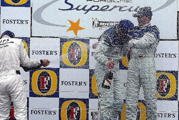 Porsche Supercup: The podium: Mike Rockenfeller Porsche Junior Team, second; Wolf Henzler Team Farnbacher, winner; Dirk Werner Team Farnbacher, third