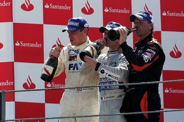 Porsche Supercup: The podium: Richard Westbrook HISAQ Competition, second; Damien Faulkner race winner; Uwe Alzen, third