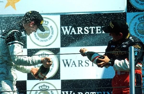 Porsche Supercup: Race winner Jorg Bermeister has a champagne fight with 3rd place Stephane Ortelli