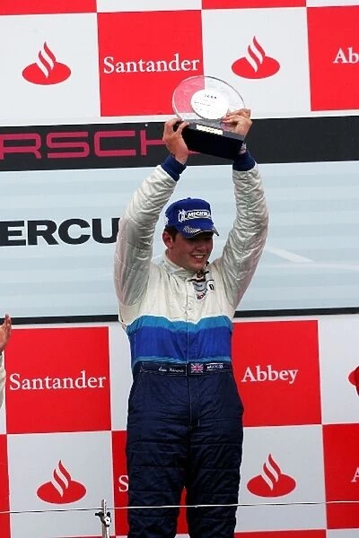 Porsche Supercup: Race winner Shaun Edwards celebrates on the podium
