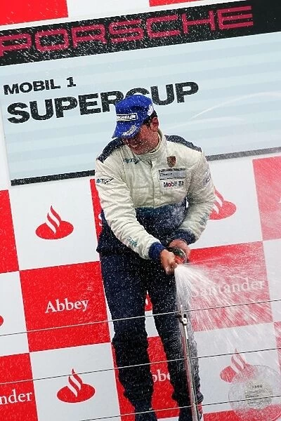 Porsche Supercup: Shaun Edwards celebrates his win on the podium