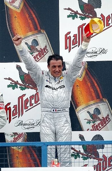 Race winner Jean Alesi (FRA), AMG-Mercedes, celebrates on the podium