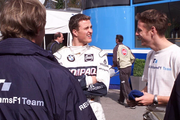 Ralf Schumacher and Jenson Button share a joke