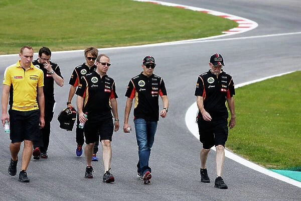 Red Bull Ring, Spielberg, Austria. Thursday 19 June 2014. Pastor Maldonado, Lotus F1, walks the track with his engineers and Charles Pic, Reserve Driver, Lotus F1 Team. World Copyright: Charles Coates / LAT Photographic. ref: Digital Image _J5R5620