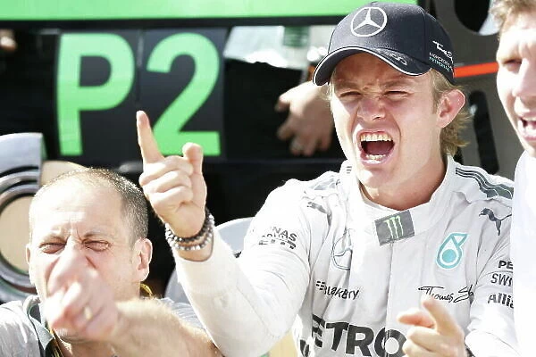 Red Bull Ring, Spielberg, Austria. Sunday 22 June 2014. Nico Rosberg, Mercedes AMG, 1st Position, celebrates victory with his team. World Copyright: Alastair Staley / LAT Photographic. ref: Digital Image _79P7675