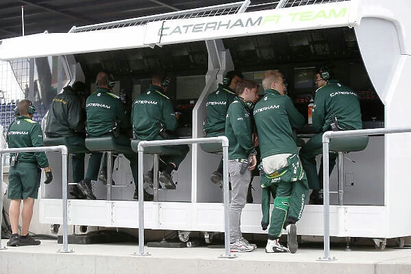 Red Bull Ring, Spielberg, Austria. Friday 20 June 2014. Robin Frijns, Reserve Driver, Caterham F1, and Marcus Ericsson, Caterham F1, on the pit wall with Caterham team mates. World Copyright: Charles Coates / LAT Photographic. ref