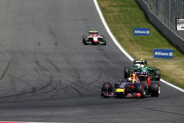 Red Bull Ring, Spielberg, Austria. Sunday 22 June 2014. Sebastian Vettel, Red Bull Racing RB10 Renault, leads Marcus Ericsson, Caterham CT05 Renault, and Max Chilton