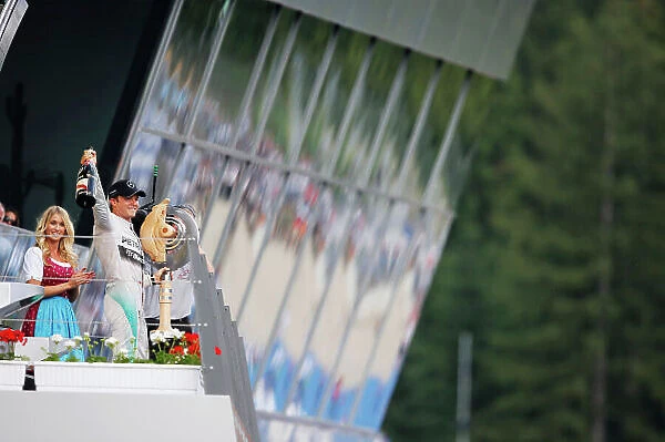 Red Bull Ring, Spielberg, Austria. Sunday 22 June 2014. Nico Rosberg, Mercedes AMG, 1st Position, celebrates on the podium. World Copyright: Steven Tee / LAT Photographic. ref: Digital Image _X0W0952